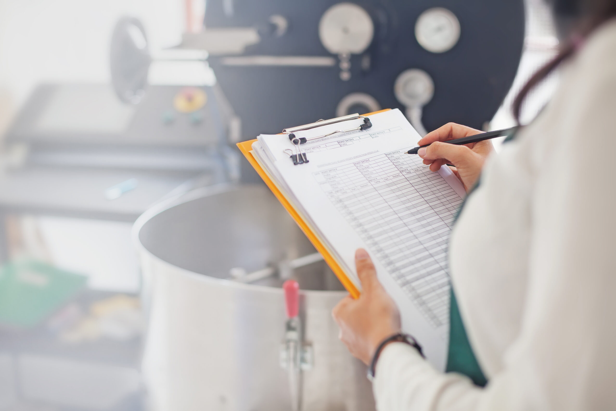 Hand,Signing,Document,About,Coffee,Roasting,At,Factory